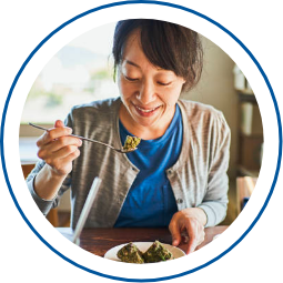 Photo of a woman having a meal