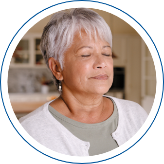 Photo of a woman in meditation, with her eyes closed