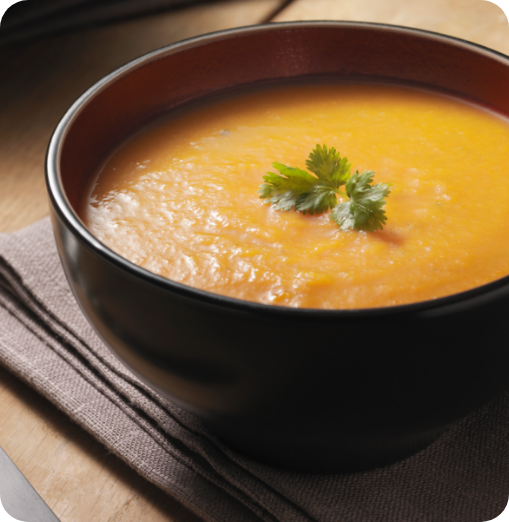 Photo of a bowl of soup with garnish